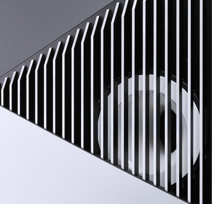 Close-up of a Burmester BC350 Signature Line Speaker with vertical slats on a gray background - HiFi Centre.