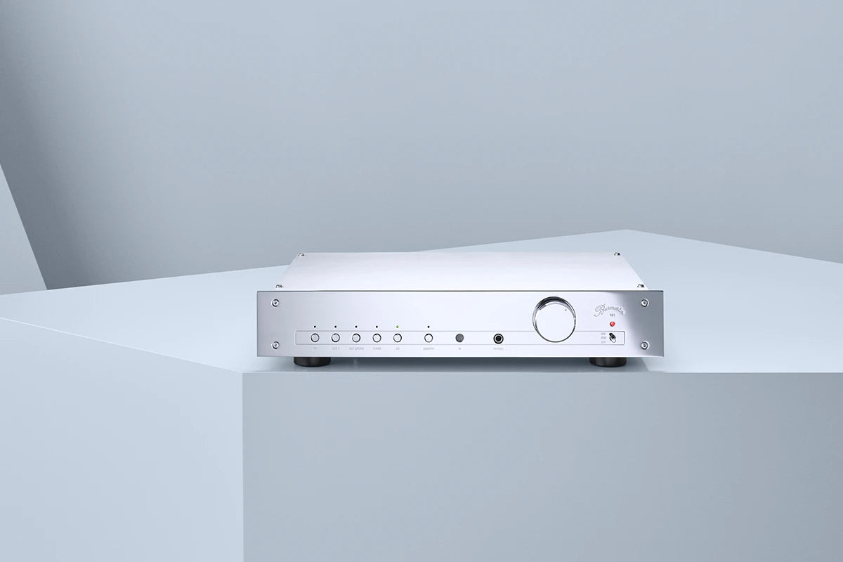 Burmester 101 Classic Line Integrated Amplifier on a white platform with a light gray background.
