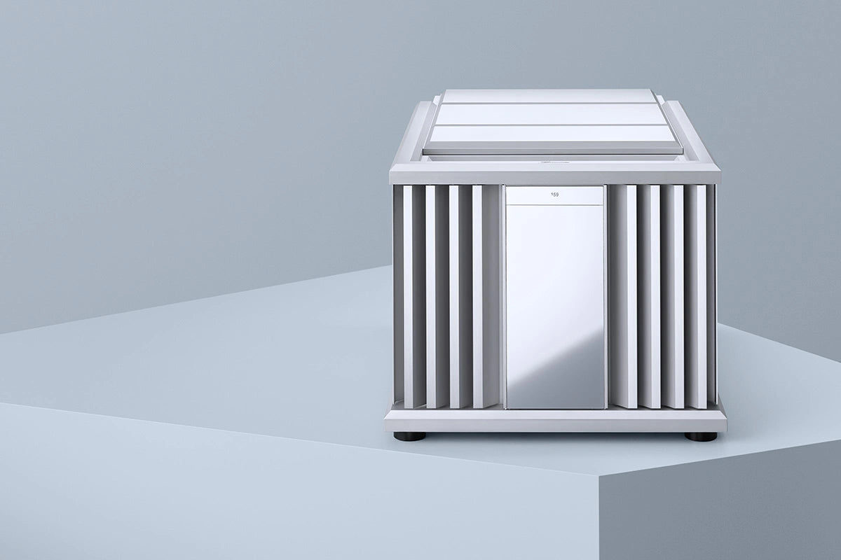 Modern metallic Burmester 159 Signature Line Mono Amplifier on a light gray surface with a neutral background