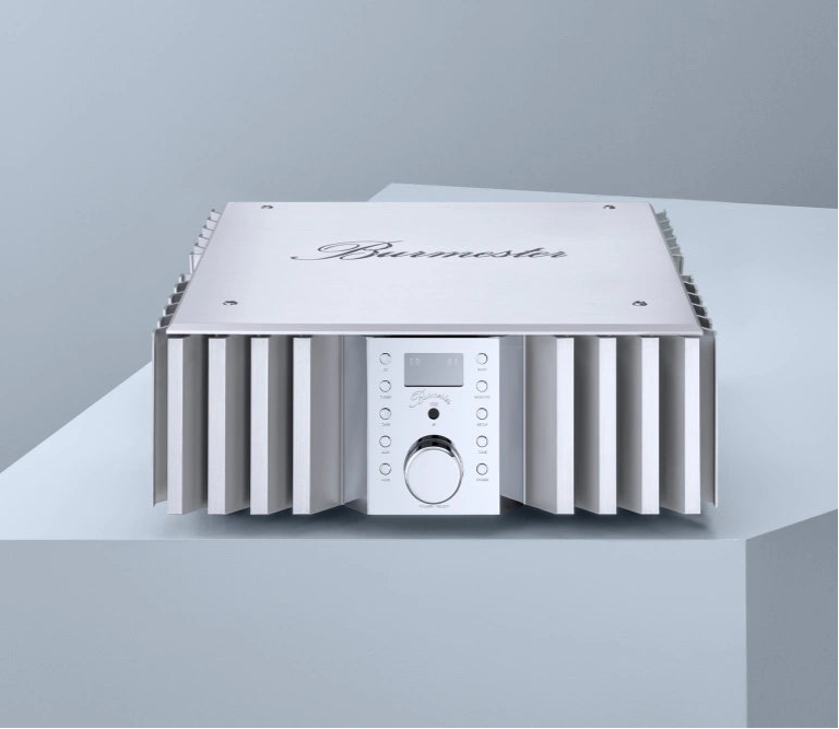 Silver Burmester 032 Classic Line Integrated Amplifier on a gray platform with a light gray background.