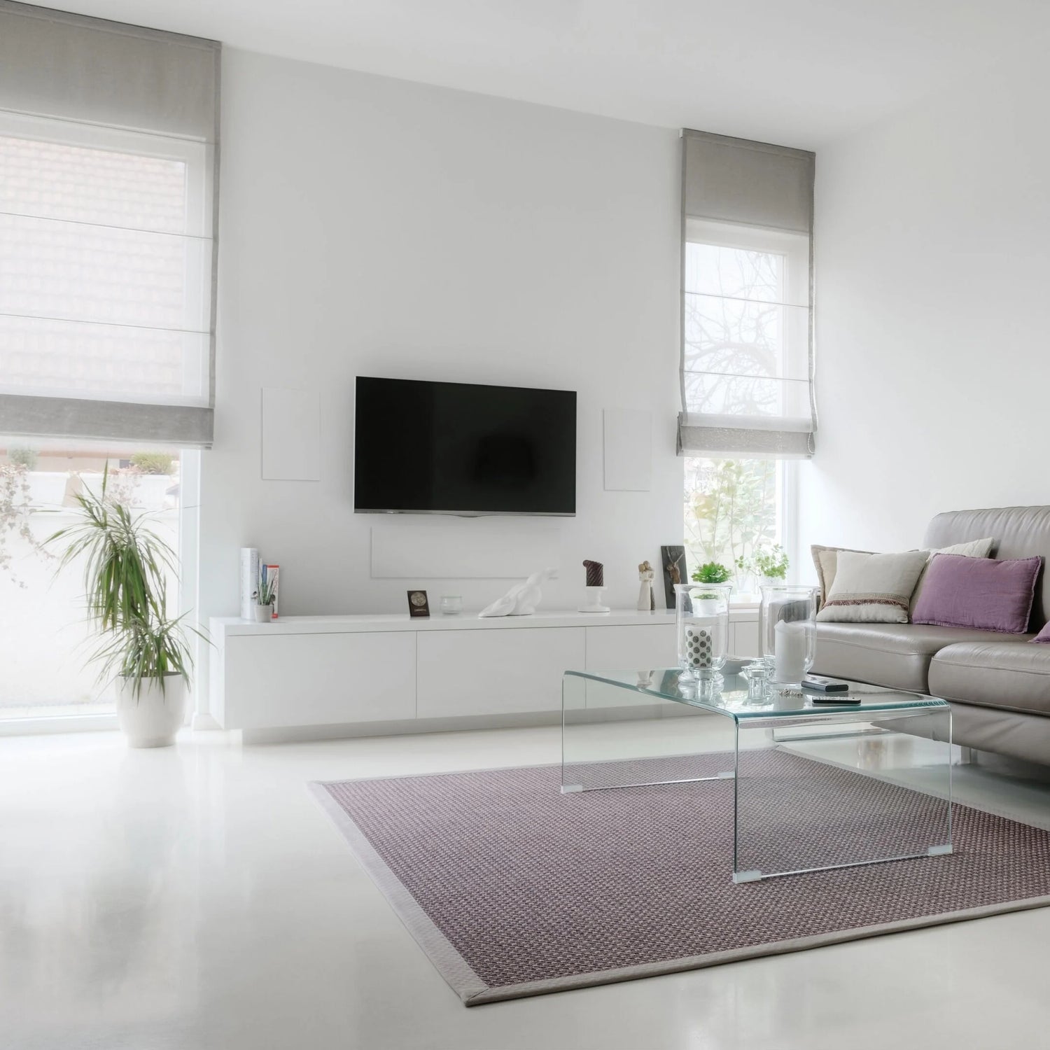 A pair of B&W CWM663 In-Wall Speakers in a modern living room.