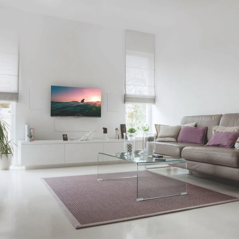 A pair of B&W CWM7.5S2 In-Wall Speakers in a ultra modern living room.