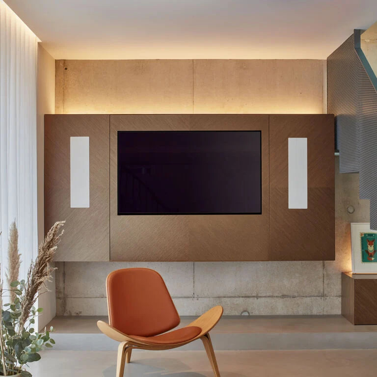 A pair of B&W CWM7.4S2 In-Wall Speakers in a modern living room or home theatre.