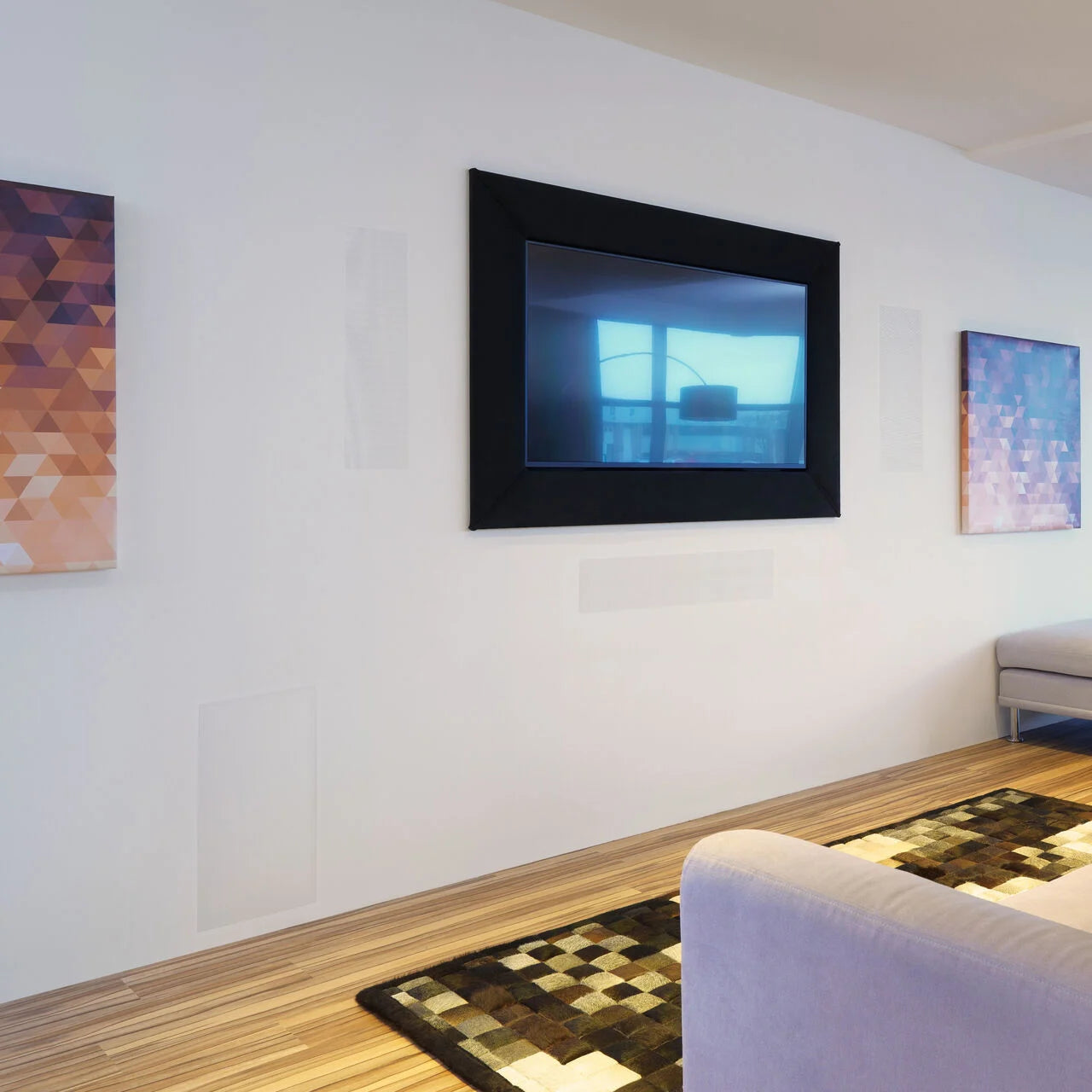 B&W ISW4 In-Wall Subwoofer installed in a modern living room.