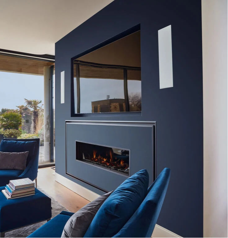 B&W CWM7.3S2 In-Wall Speaker in a modern beachside living room.