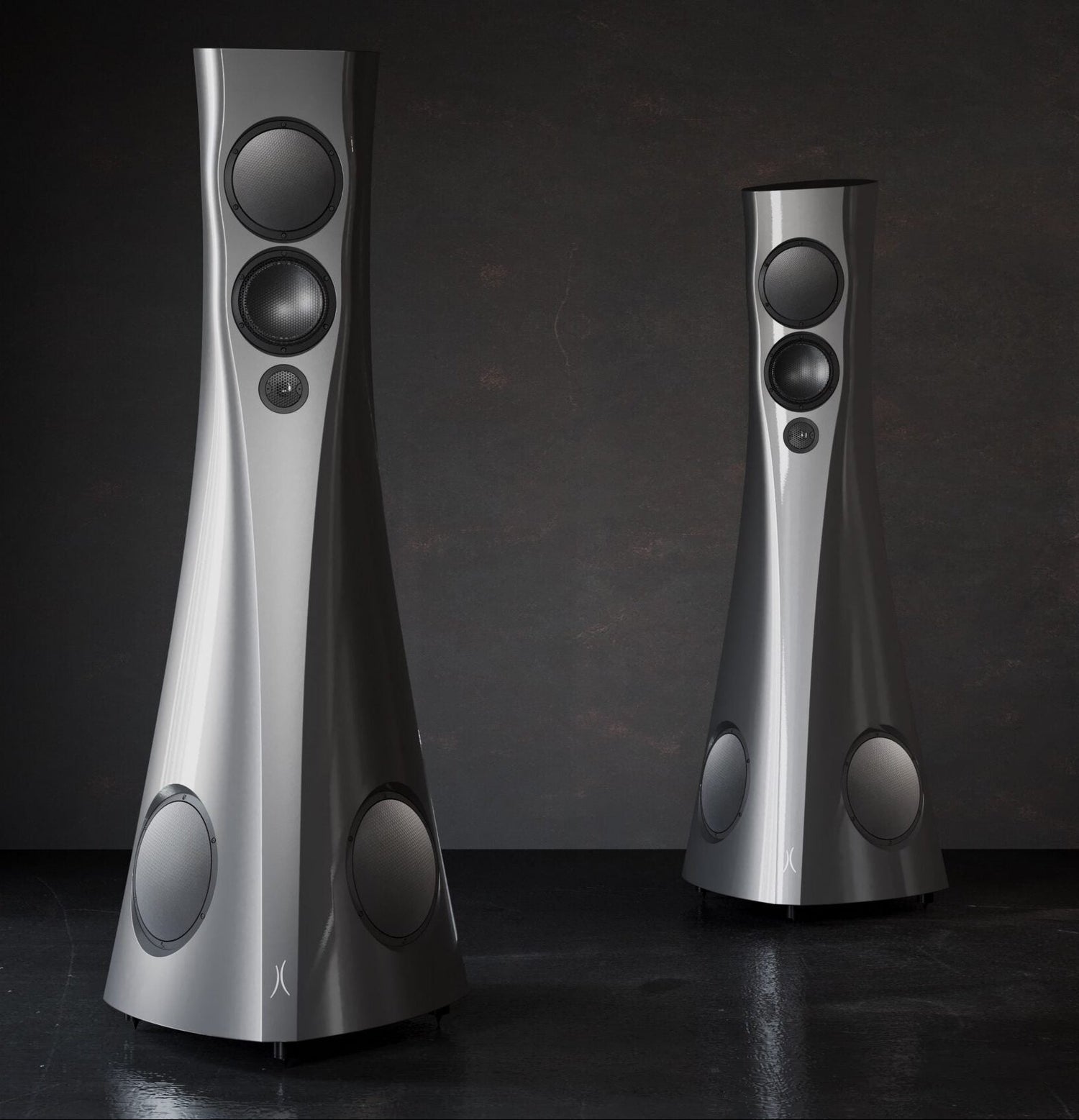 Two silver Estelon Forza Reference Speakers on a dark background
