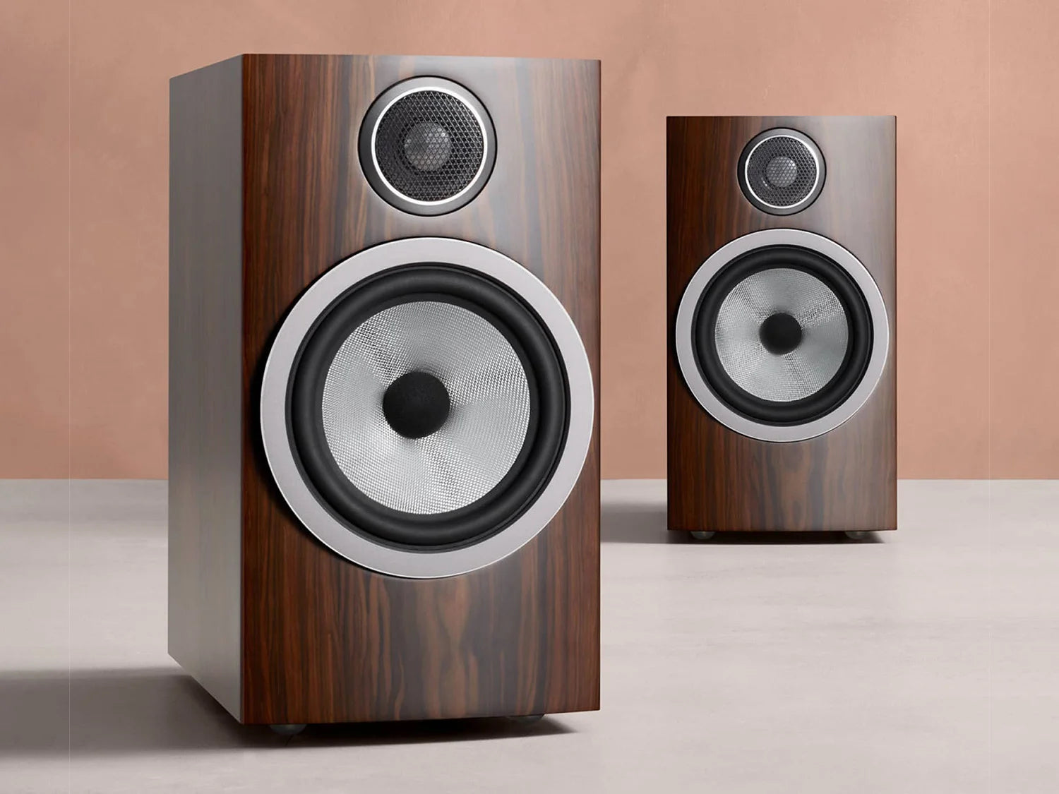 A pair of B&W 706 S3 Bookshelf Speakers in mocha finish.