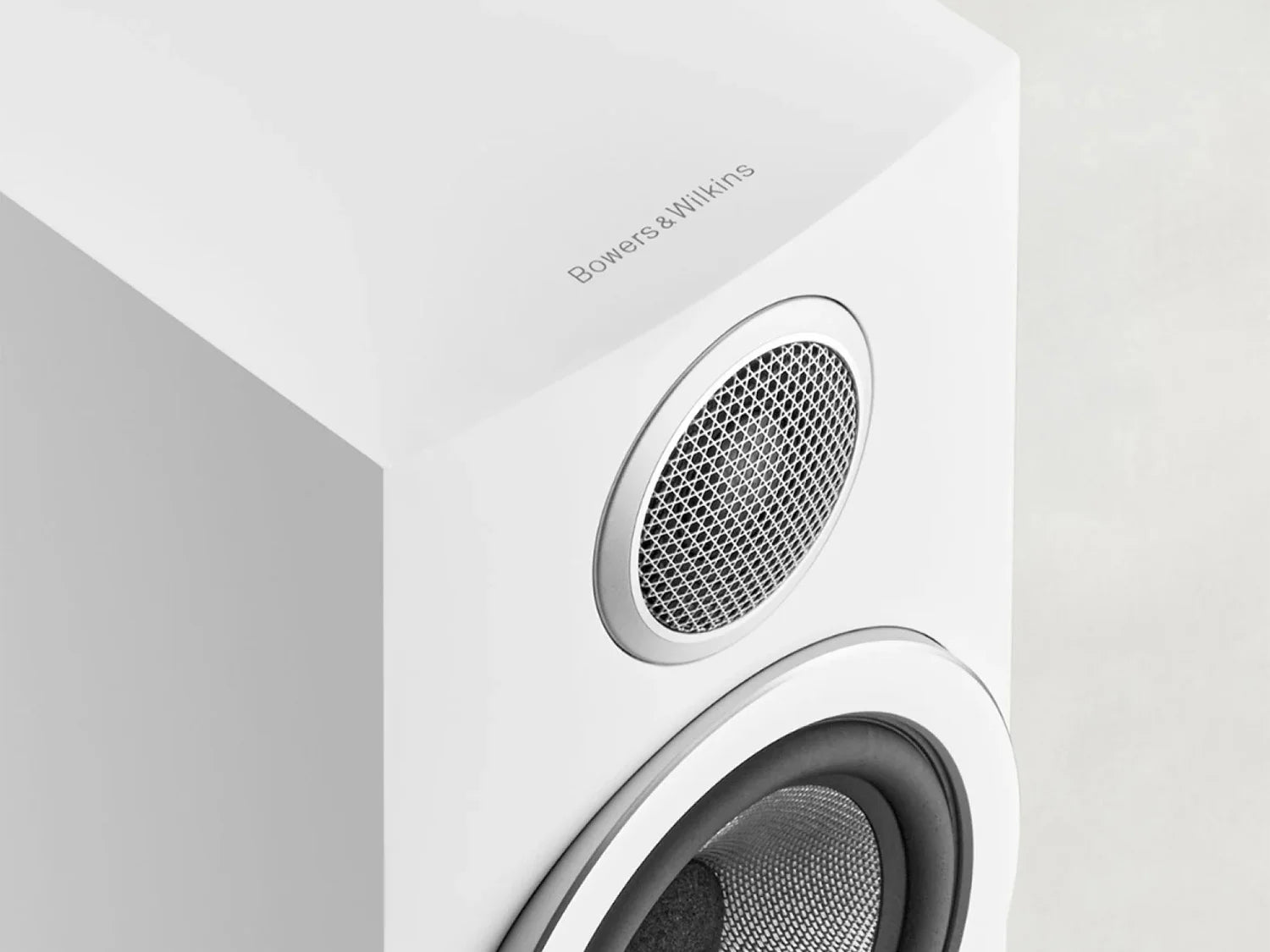 Curved cabinet baffle and individual drive unit pods on a B&W 707 S3 Bookshelf Speaker in white.