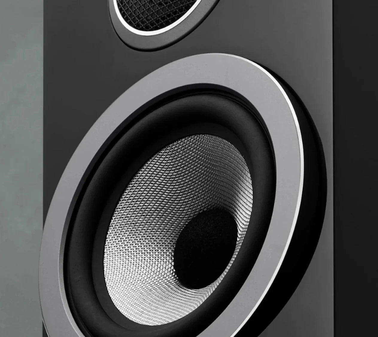 The closeup of the Continuum™ cone with its composite construction on a B&W 707 S3 Bookshelf Speaker.
