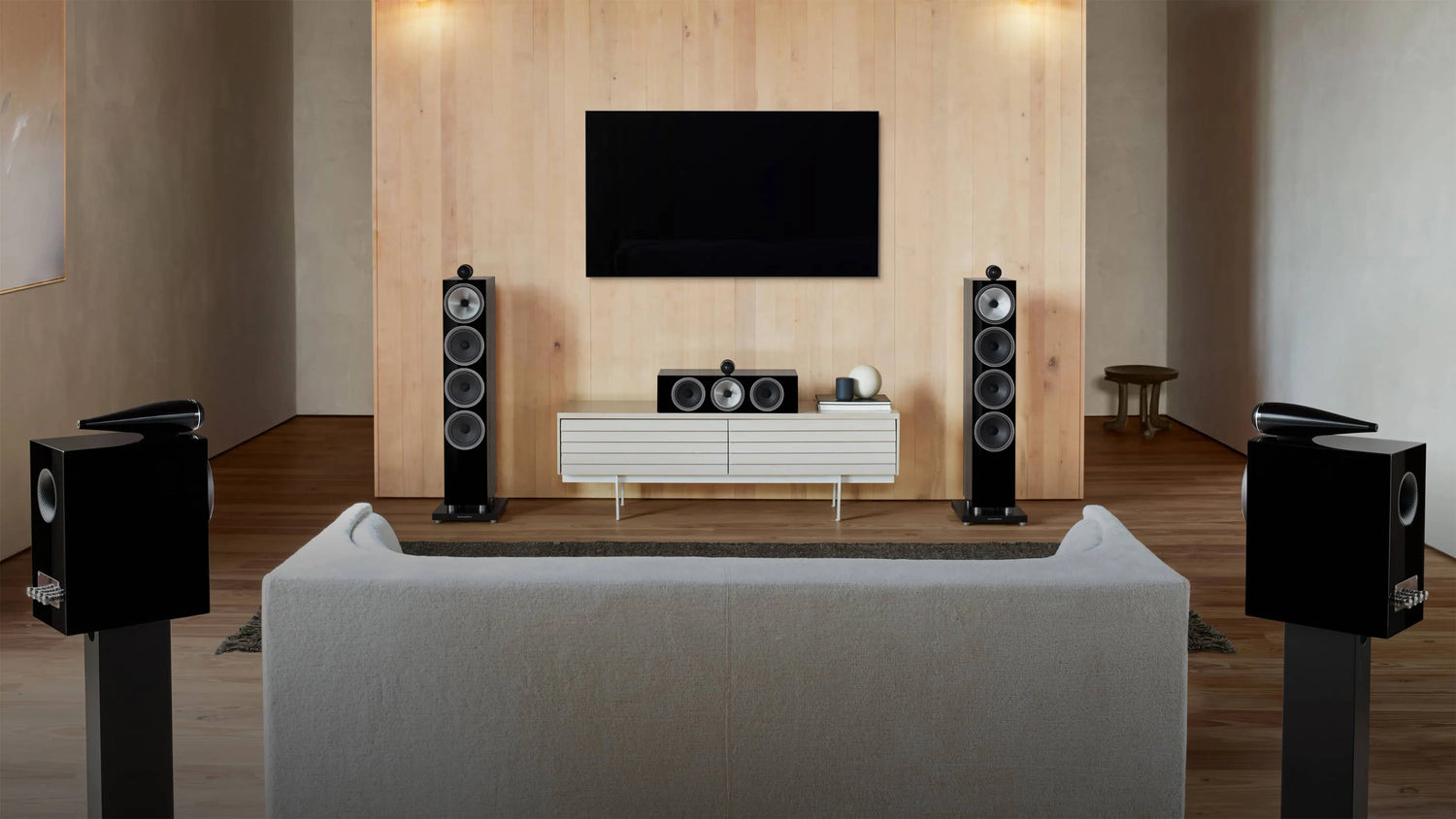 A modern home theatre featuring B&W HTM71 S3 speaker in gloss black finish.