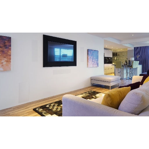 A pair of B&W CWM663 In-Wall Speakers in a modern TV room.