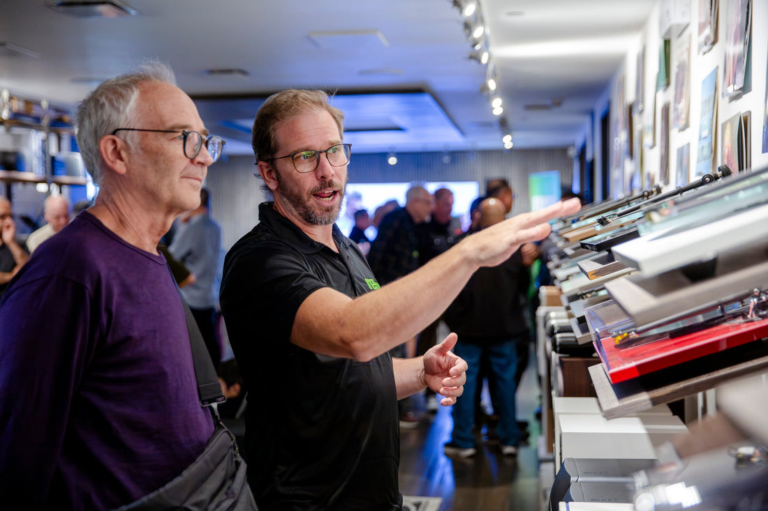 Hi-Fi Centre staff explaining turntables