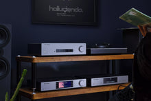 Cambridge Audio CXC V2 CD Transport and other Cambridge audio equipments in a modern living room.