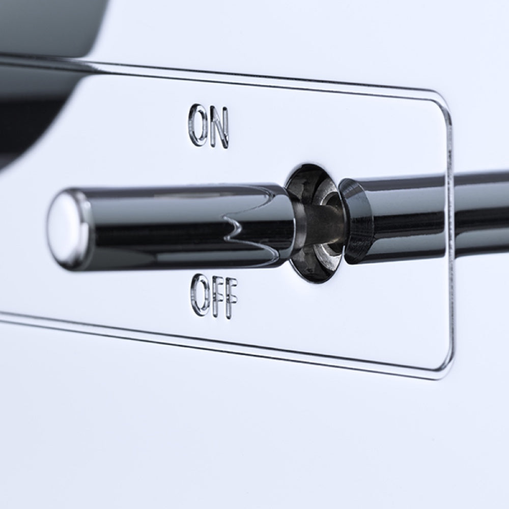 A detail of a switch of a silver Burmester 101 Classic Line Integrated Amplifier with a front-facing volume knob and input selection buttons - HiFi Centre.