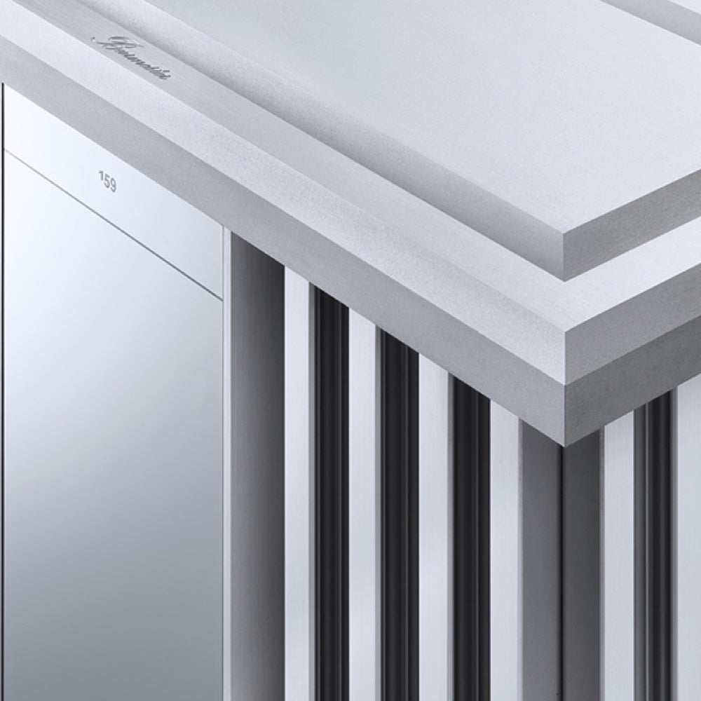 A closeup of a Burmester 159 Signature Line Mono Amplifier, a high-end audio component with a modern design featuring a grid of panels and a visible brand logo - HiFi Centre.