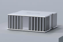 A silver Burmester 216 Top Line Power Amplifier on a gray surface - HiFi Centre. 
