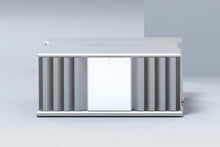 A front side of a silver Burmester 218 Reference Line power amplifier with cooling fins and ports on a gray surface - HiFi Centre.