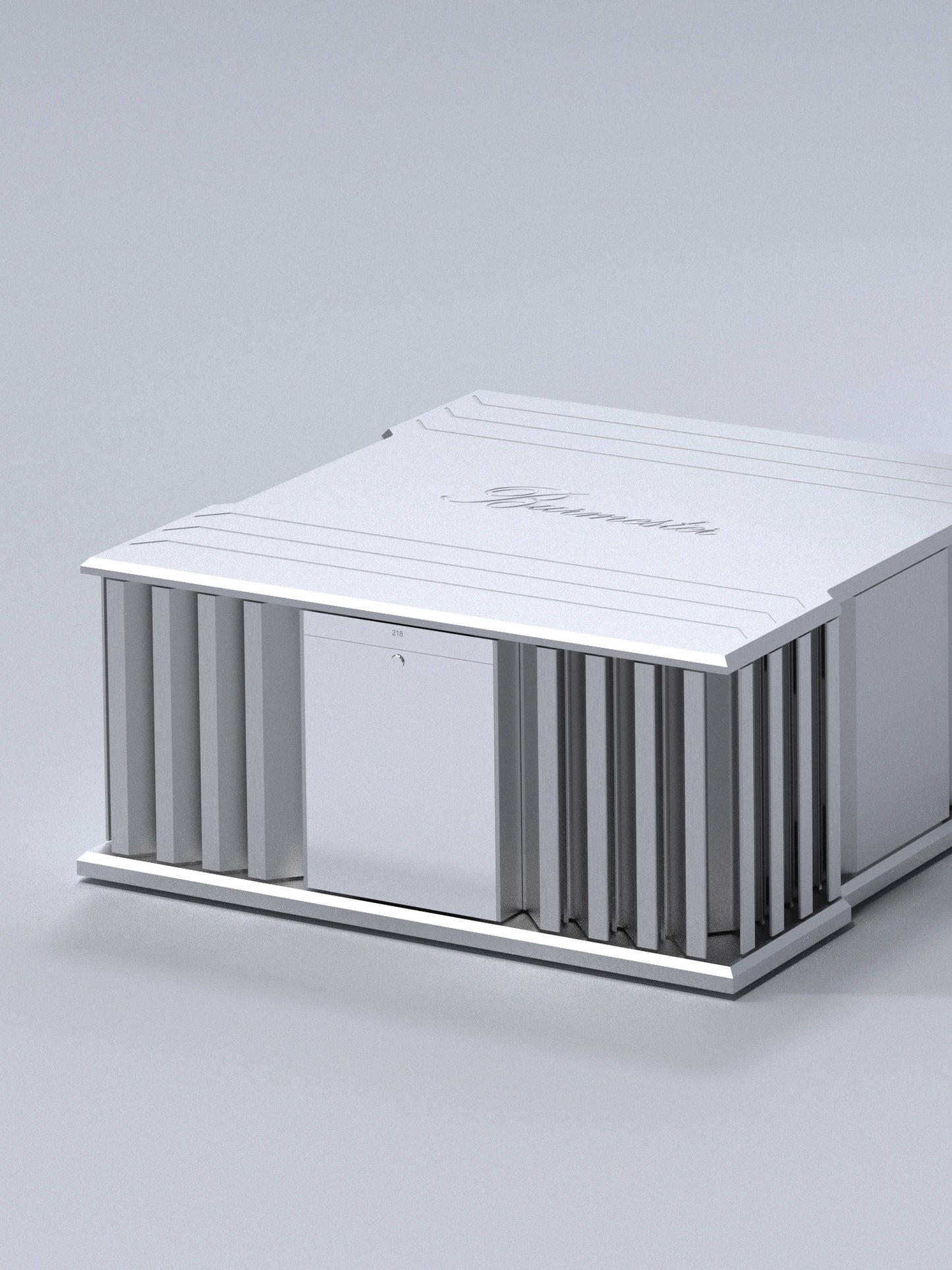 A side side of a silver Burmester 218 Reference Line power amplifier with cooling fins and ports on a gray surface - HiFi Centre.