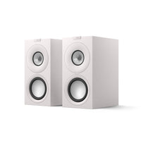 A pair of white KEF Q Concerto Meta bookshelf speakers on a white background.