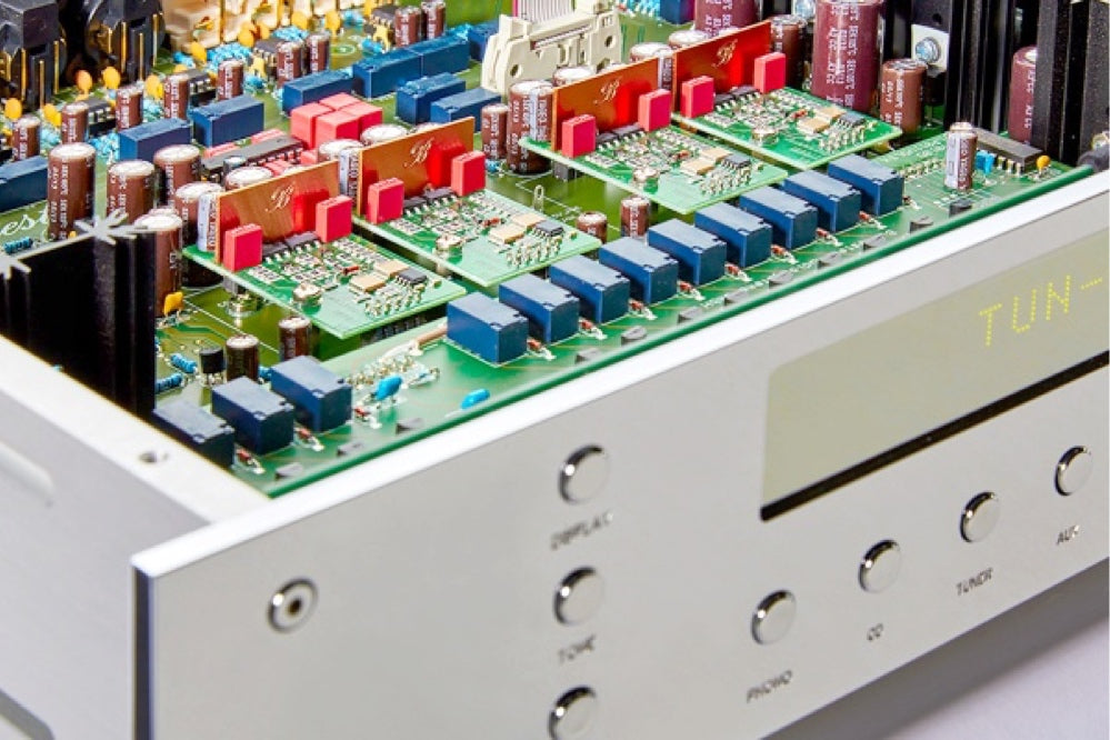 A closeup of the inside of a silver Burmester 035 Classic Line Preamplifier sold by Hi-Fi Centre.