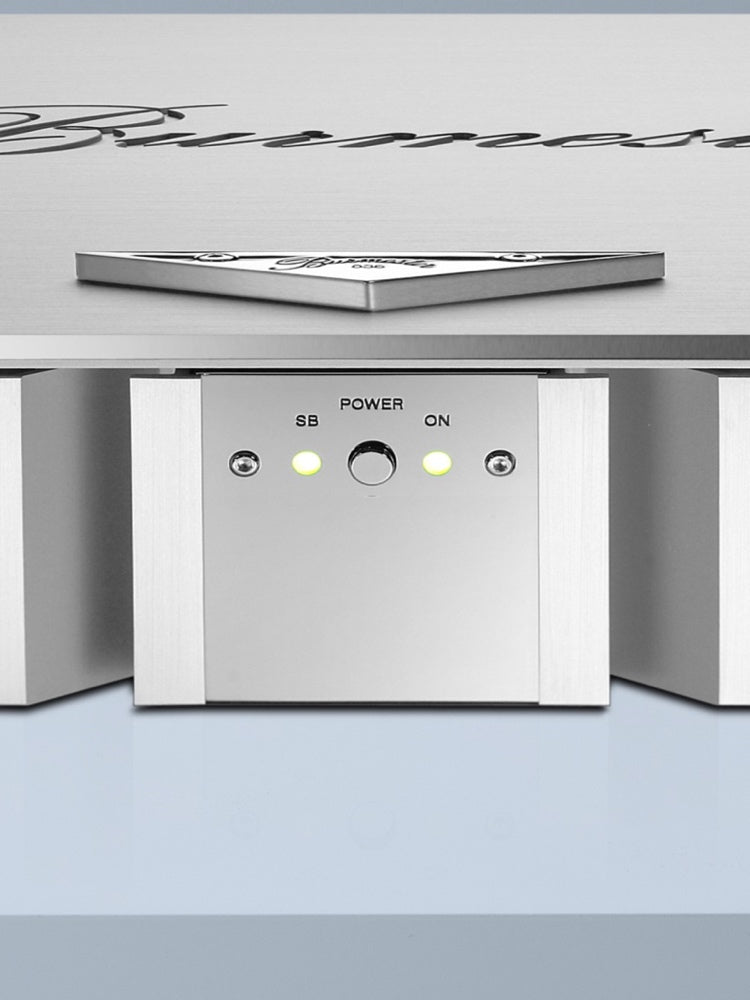 A close to the buttons of a Burmester 036 Classic Line Power Amplifier with silver-anodized aluminum cooling fins and a solid aluminum lid - sold by Hi-Fi Centre.