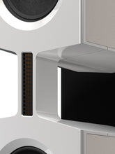 Close-up of a modern Burmester BX100 Reference Speaker with metallic finish