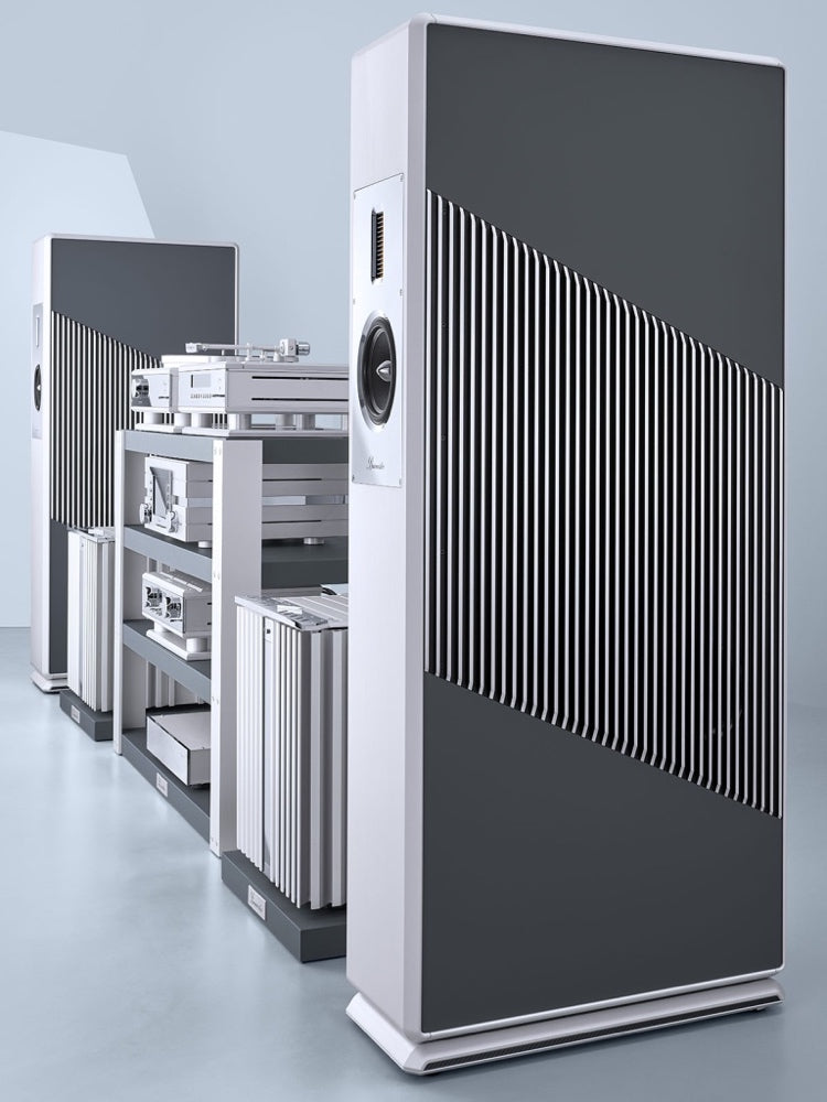 A pair of Burmester BC150 floor-standing reference line speakers, featuring a white and gray color scheme with a solid aluminum frame in a home theatre setup - HiFi Centre.
