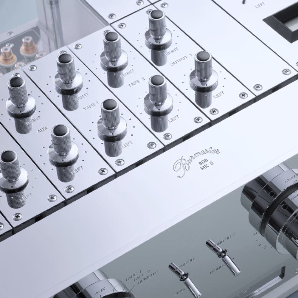 A closeup view of a silver Burmester 808 MK 5 Reference Line Preamplifier with multiple knobs and switches - Hi-Fi Centre.