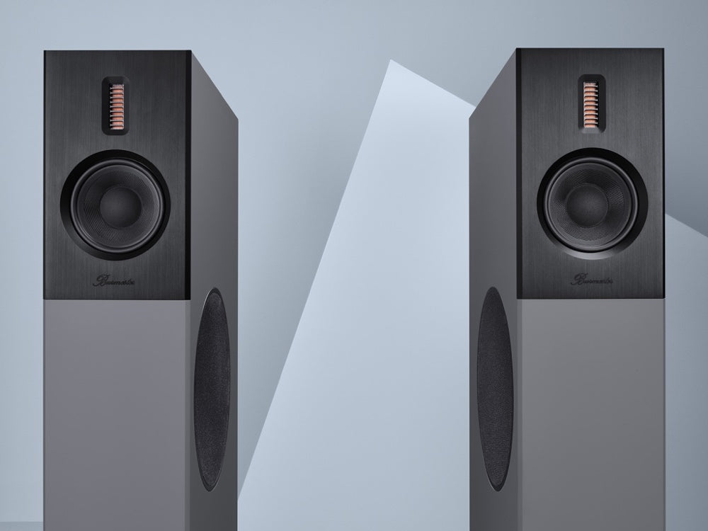 A pair of Burmester B38 top line speakers, featuring a slim, elegant design with a black finish and a front-panel speaker on each unit - HiFi Centre.