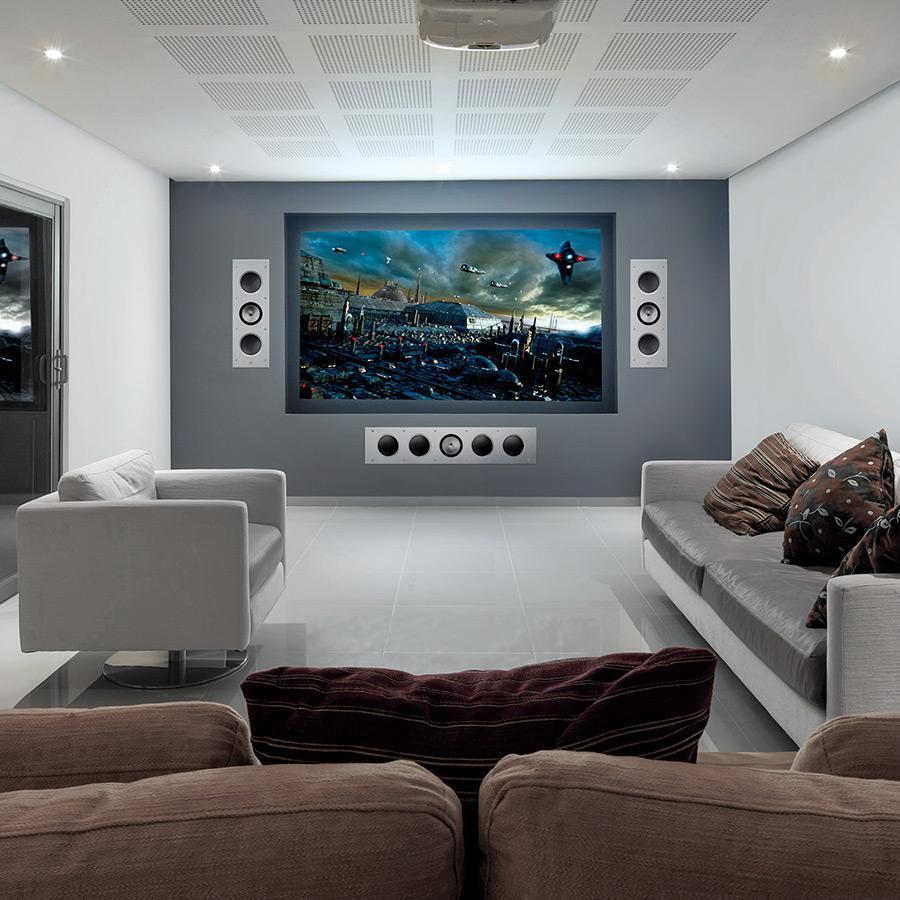 A modern home theatre with a big screen and KEF Ci5160RLM-THX Extreme In-Wall speakers installed.