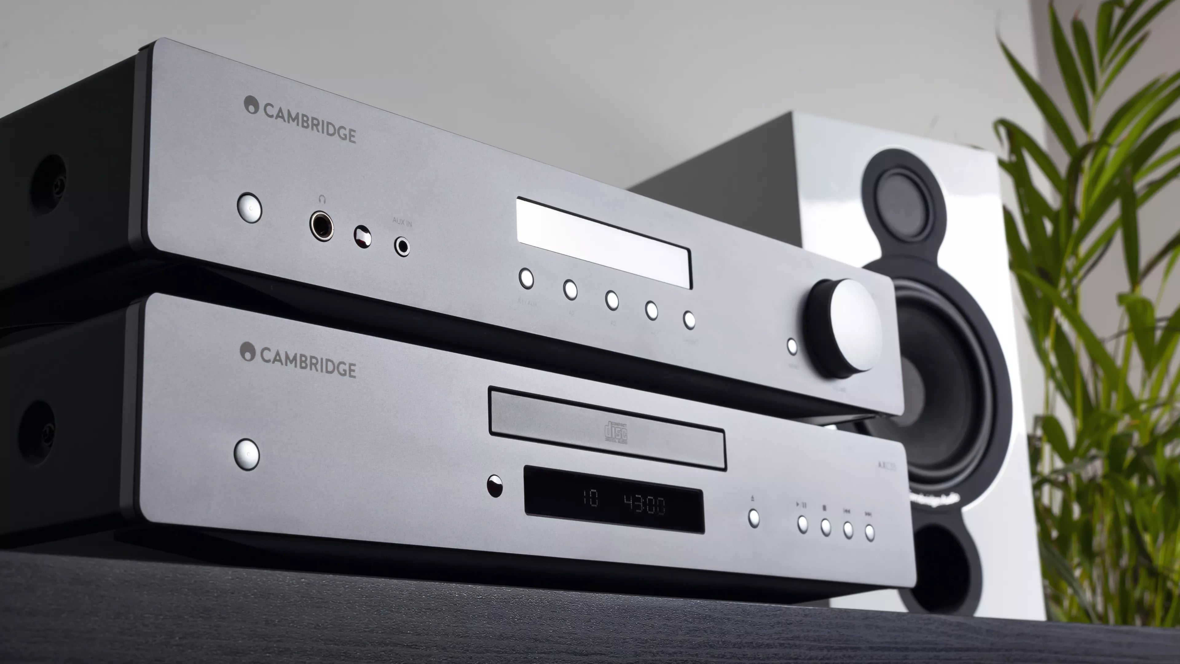 Cambridge Audio AXC35 CD Player on a table with a plant in the background