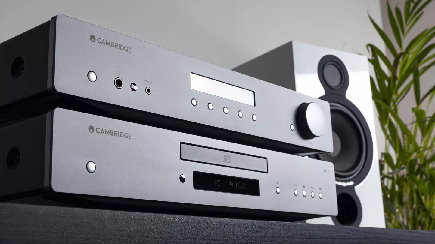 Cambridge Audio AXC35 CD Player on a table with a plant in the background