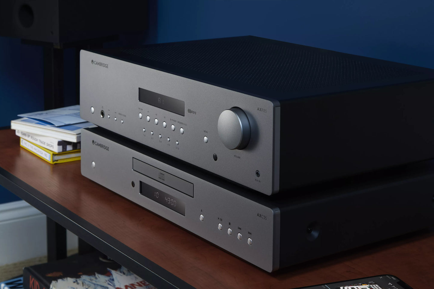 Cambridge Audio AXC35 CD Player on a wooden surface with a dark background - HiFi Centre.