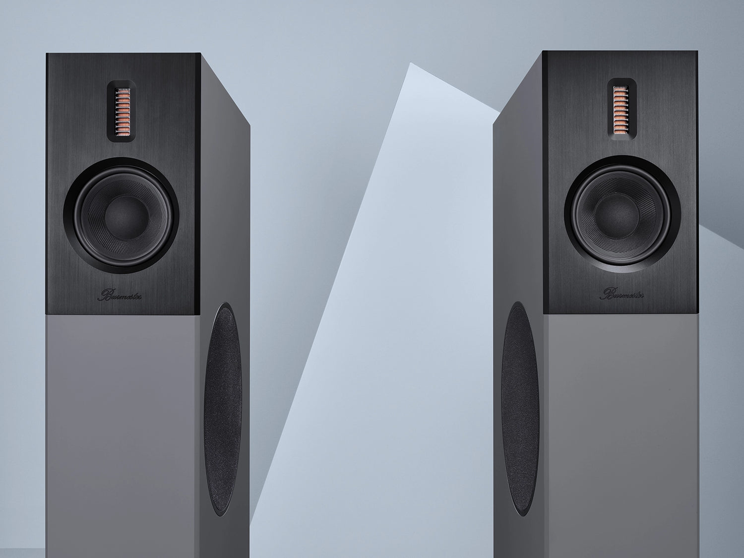 A pair of Burmester B38 Top Line Speaker in black finish on a blue background - HiFi Centre.