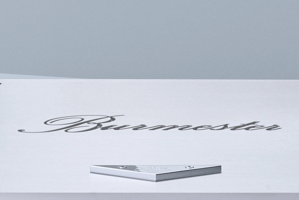 A closeup of a logo of a silver Burmester 956 MK2 Classic Line Power Amplifier - HiFi Centre.