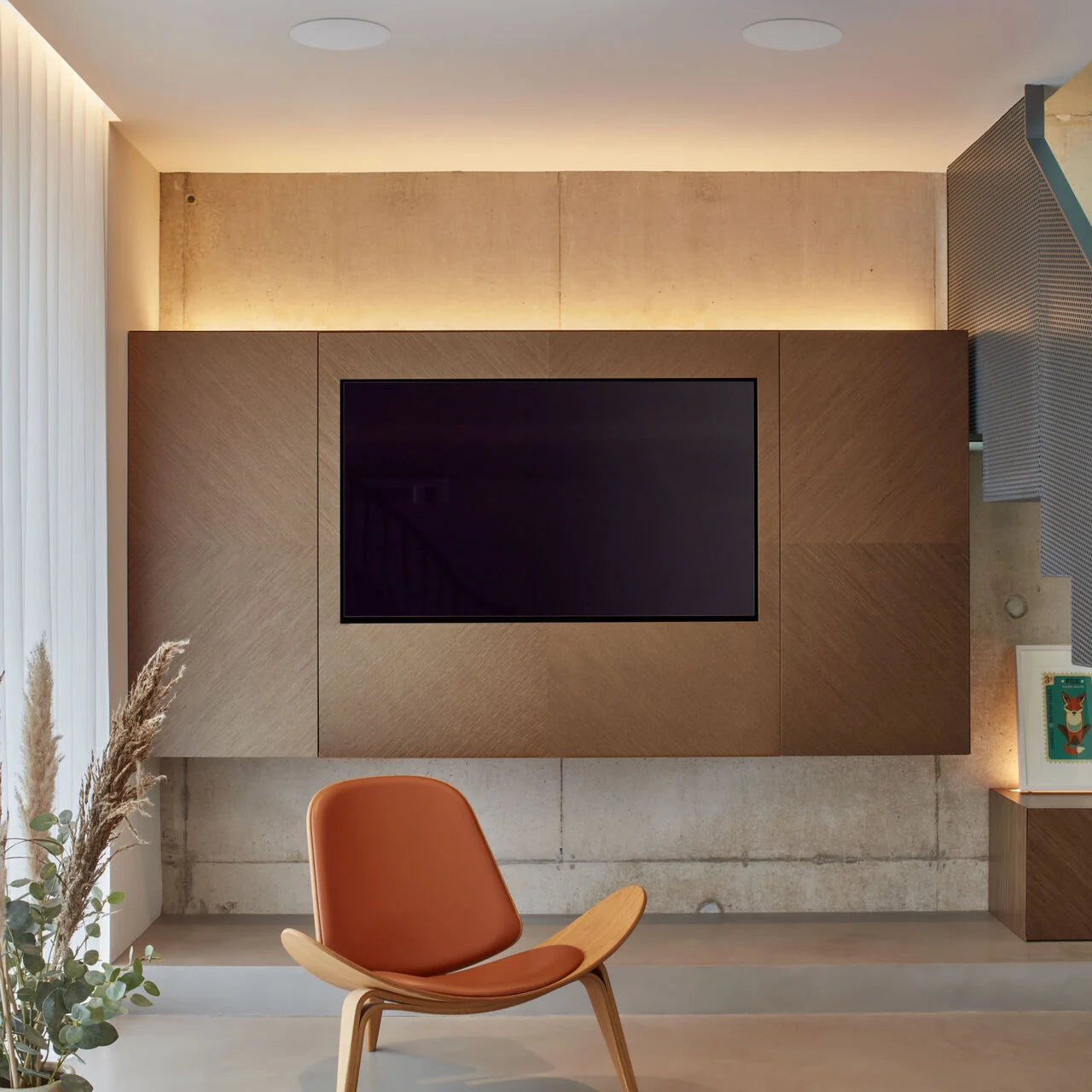 A pair of B&W CCM665 In-Ceiling Speakers in a modern TV room.