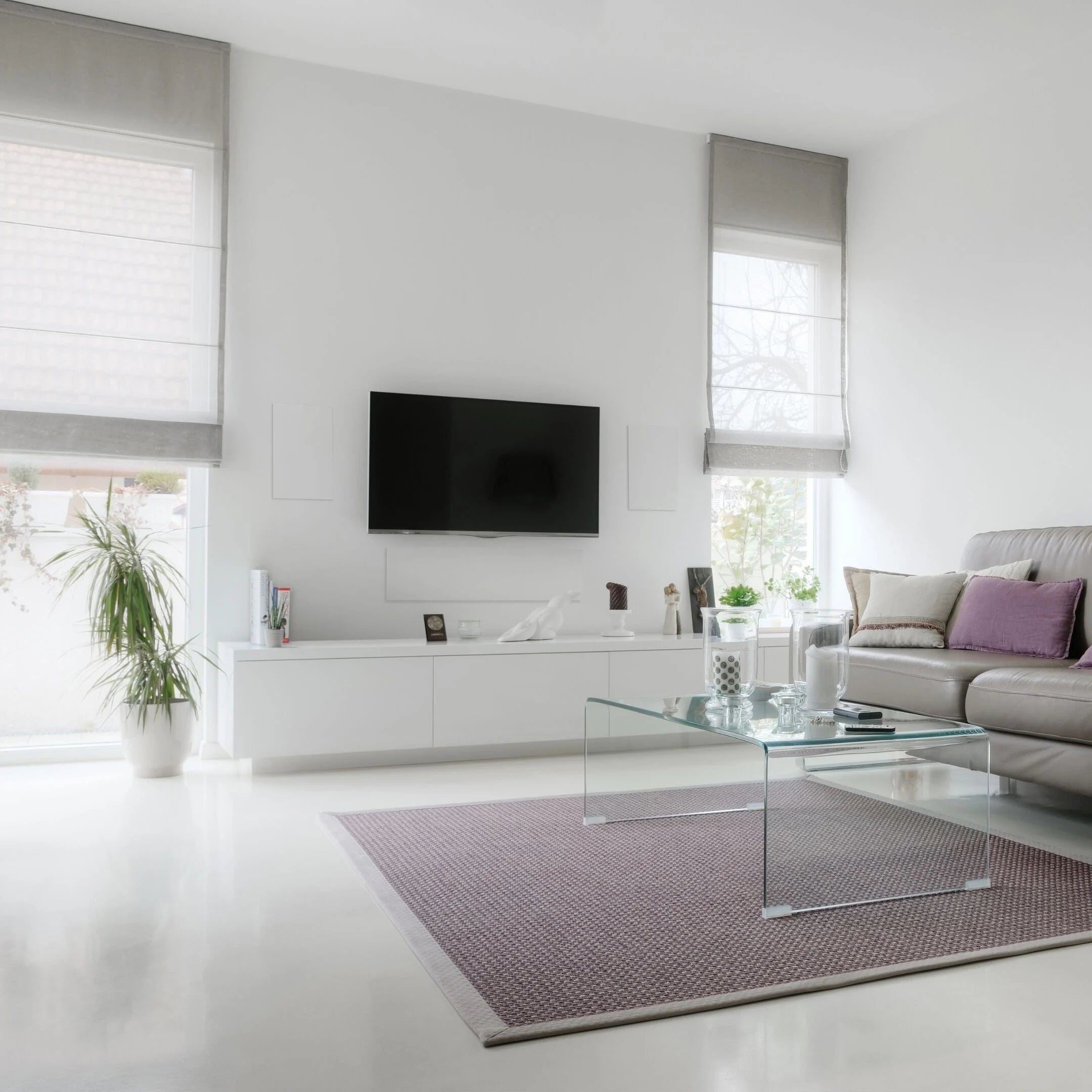 A pair of B&W CWM663 In-Wall Speakers in a modern living room.