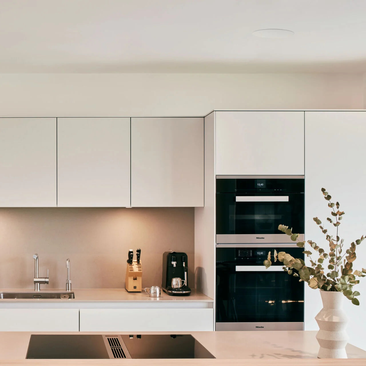 A modern kitchen with a B&W CCM664 In-Ceiling Speaker