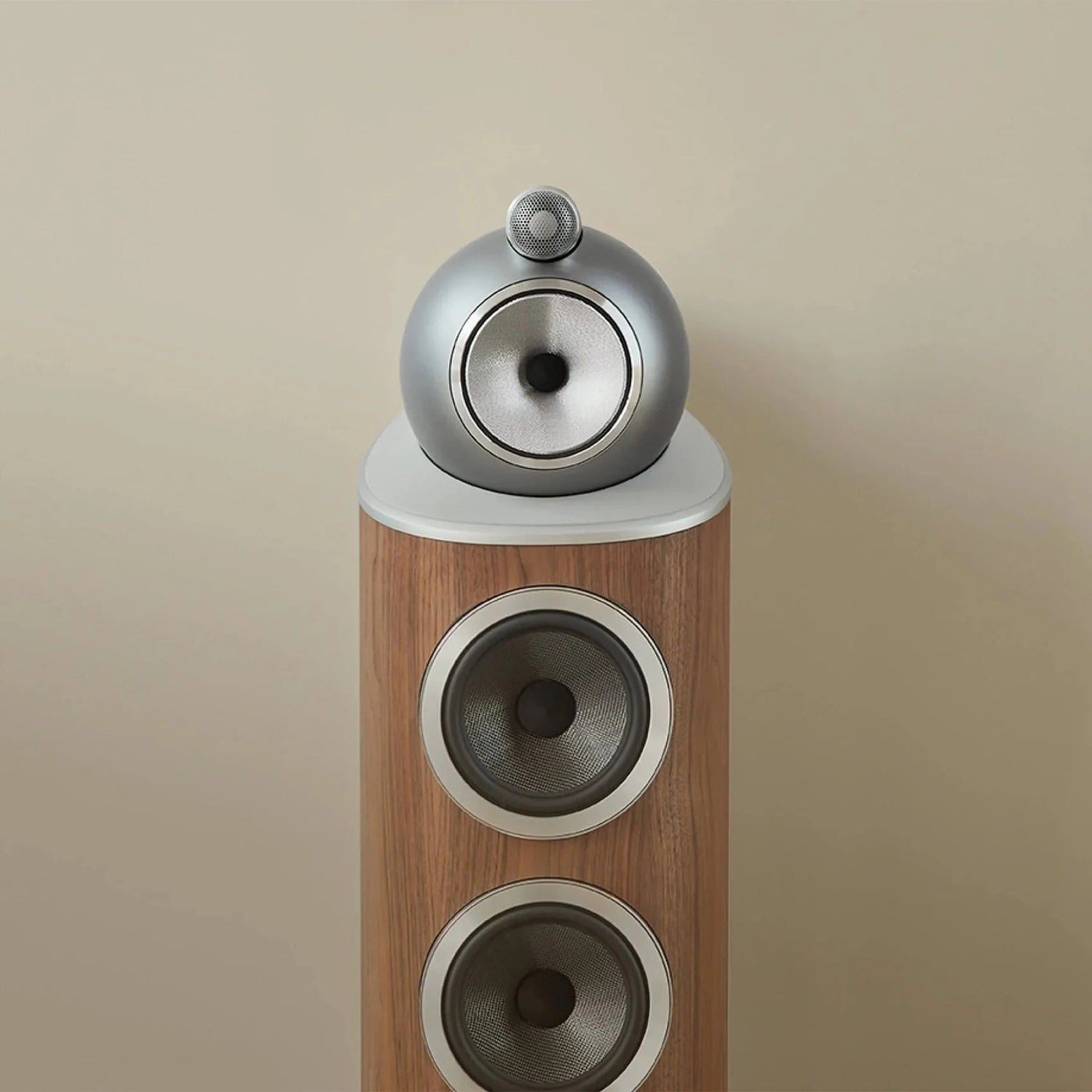 A closeup on a B&W 803 D4 Reference Speaker in walnut finish.