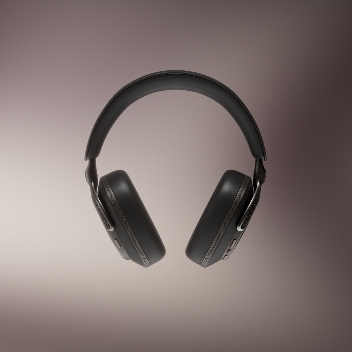 Black over-ear Bowers & Wilkins PX8 S2 Wireless Headphones on a gradient brown background