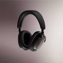 Black Bowers & Wilkins PX8 S2 Wireless Headphones on a gradient background