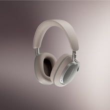 Beige Bowers & Wilkins PX8 S2 Wireless Headphones on a gradient background