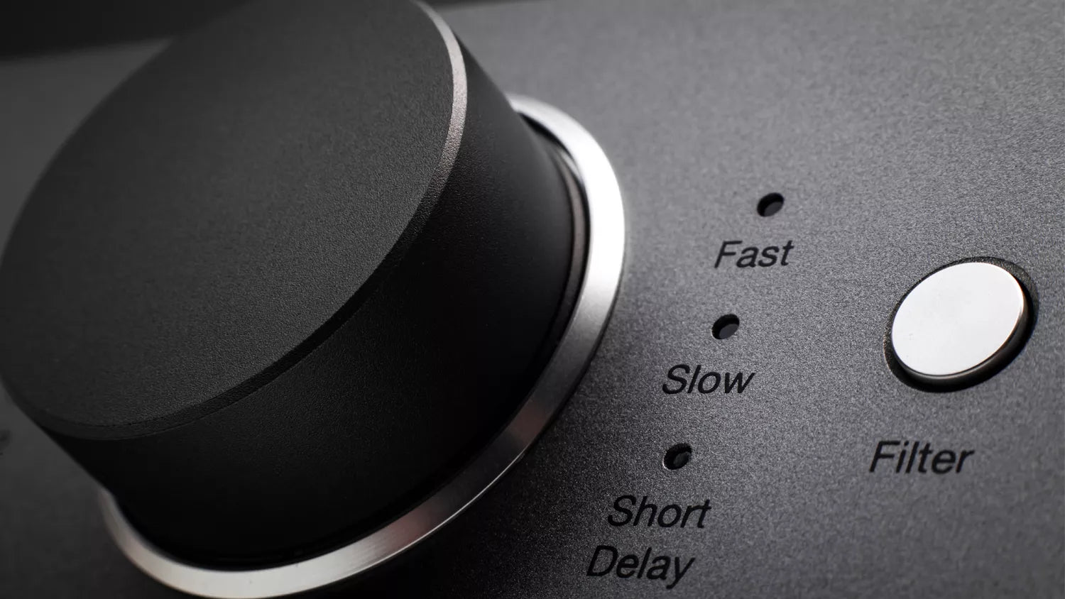 Control panel of Cambridge Audio DACMAGIC 200M DAC with knobs and labeled buttons on a dark background