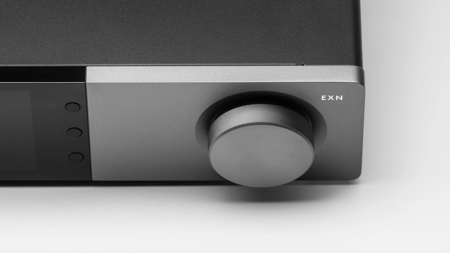 Close-up of a Cambridge Audio EXN100 Network Player with a knob labeled 'EXN' on a white background