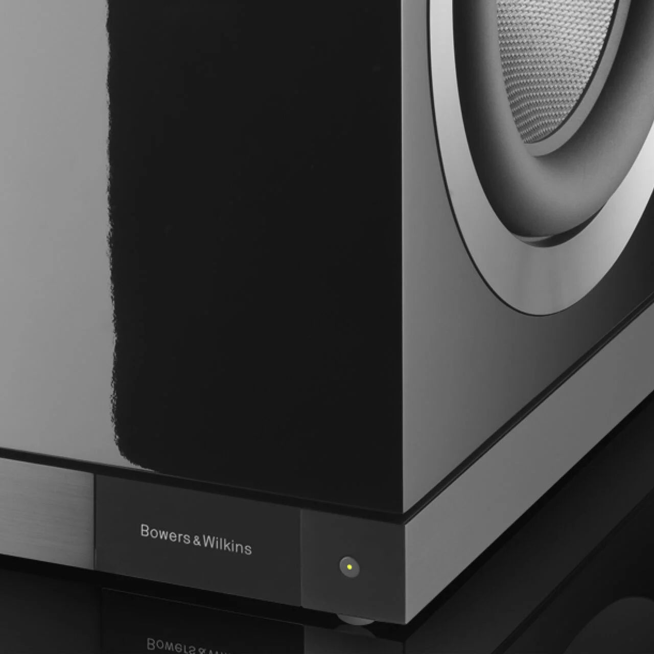 Close-up of a Bowers & Wilkins DB1D Dual 12” subwoofer on a dark background