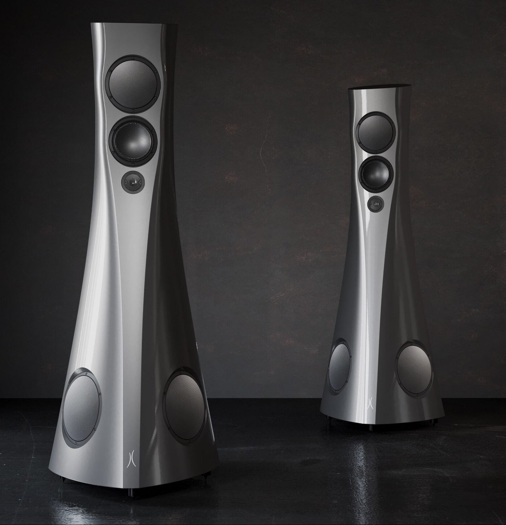 Two silver Estelon Forza Reference Speakers on a dark background