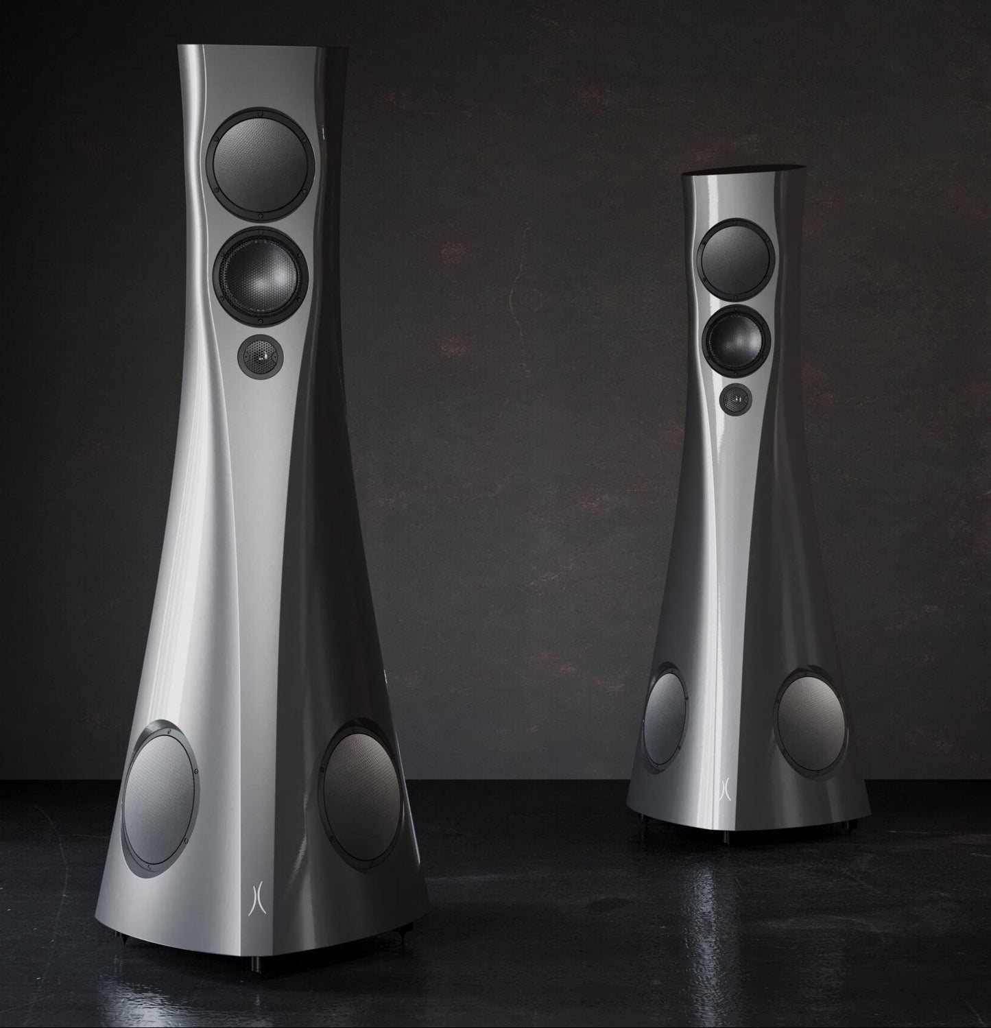 Two silver Estelon Forza Reference Speakers on a dark background