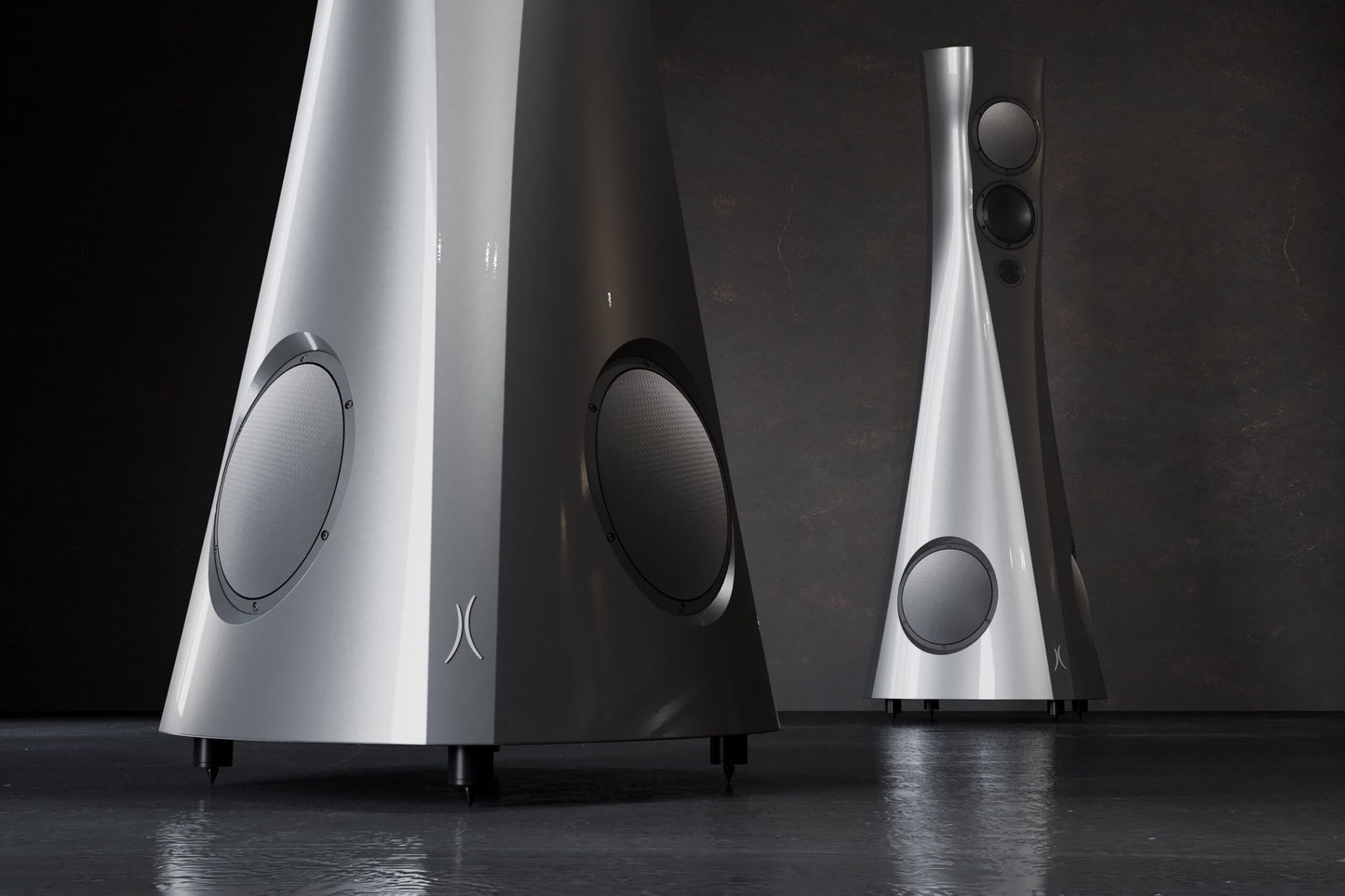 Two silver Estelon Forza Reference Speakers on a dark background