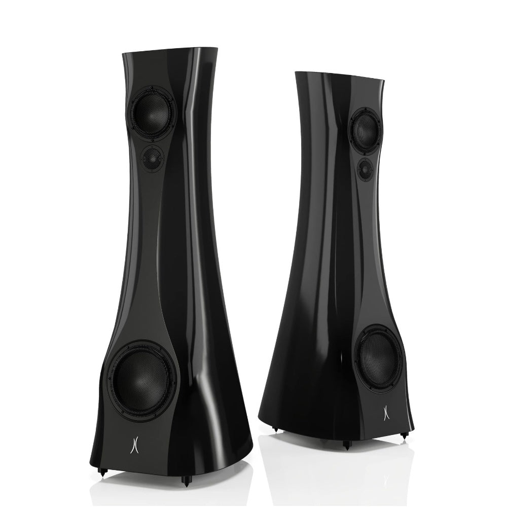 A pair of Black Lava Liquid Gloss Estelon XB MK II reference speakers with a curved-sculptural design, standing in a reflective environment.