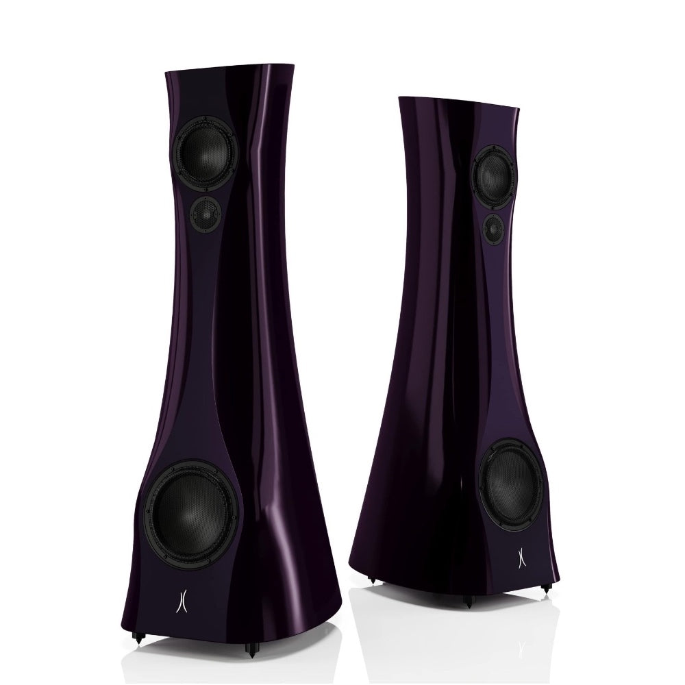 A pair of Violet Night Liquid Gloss Estelon XB MK II reference speakers with a curved-sculptural design, standing in a reflective environment.